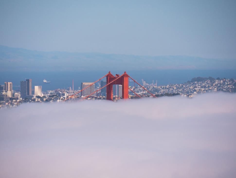 Free Image of Golden Gate Bridge emerging through thick fog at San Francisco bay 