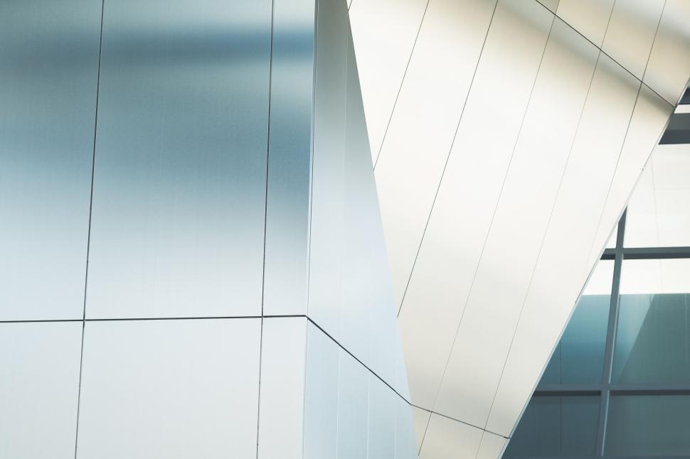 Free Image of Modern architectural structure with sleek metallic panels view. 