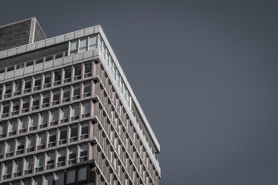 Free Image of High-rise building against a gray sky capturing urban architecture 