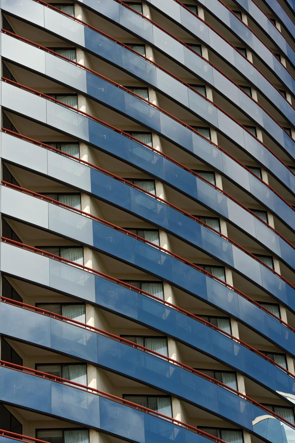 Free Image of Modern architectural building with repetitive balcony design pattern 