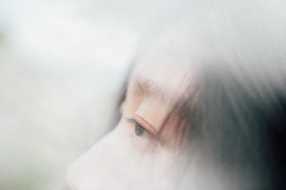 Free Image of Close-up profile of an eye partially obscured by a foggy effect 