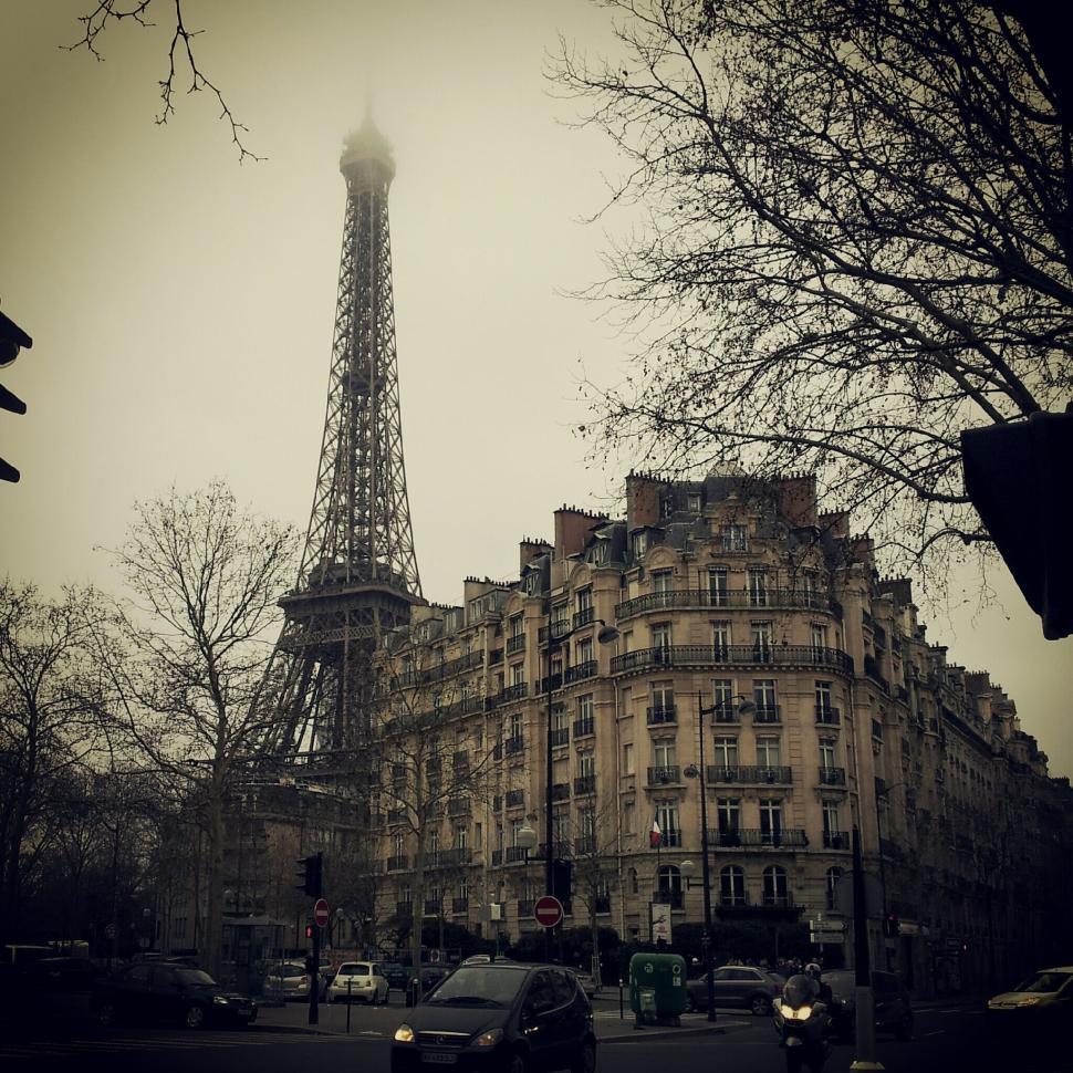 Free Image of Historic building and Eiffel Tower in a foggy Parisian day 