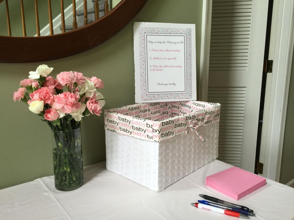 Free Image of Memory box setup for baby shower with pink carnations 