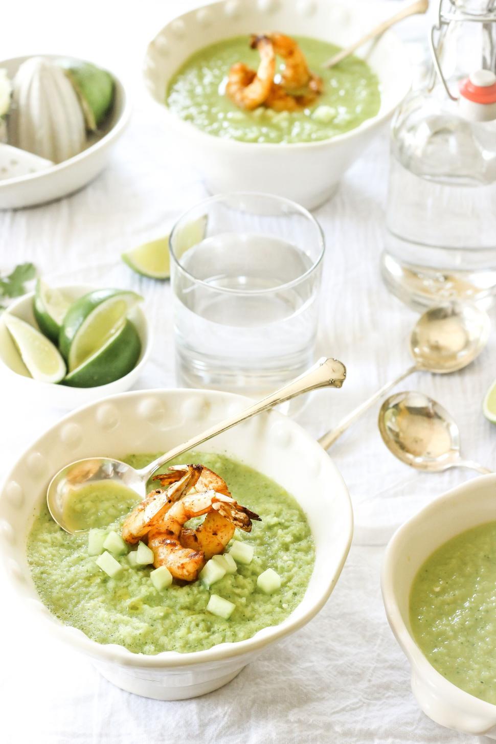 Free Image of Green gazpacho soup with grilled shrimp and cucumber cubes 