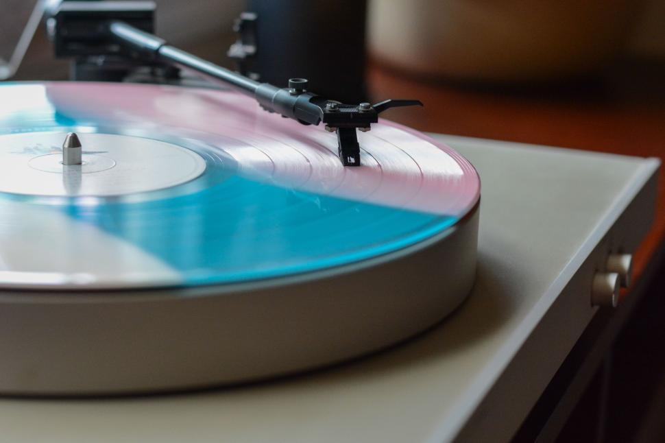 Free Image of Colorful vinyl record on turntable spinning in artistic motion 