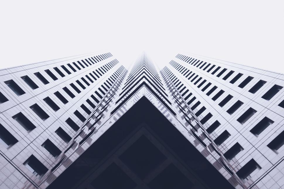 Free Image of Symmetrical skyscraper reaching towards the sky in urban landscape. 