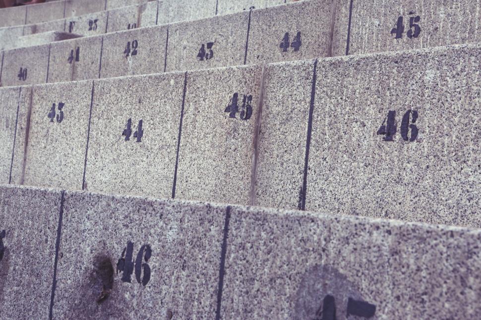 Free Image of Concrete steps with numbers painted, orderly yet worn details 