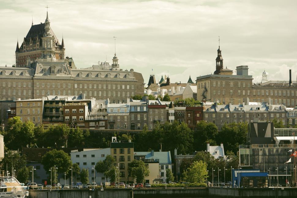 Free Image of Panoramic view of cityscape with prominent castle building on hill 