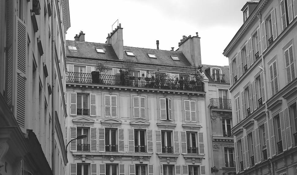 Free Image of Classical European buildings with shuttered windows on overcast day. 