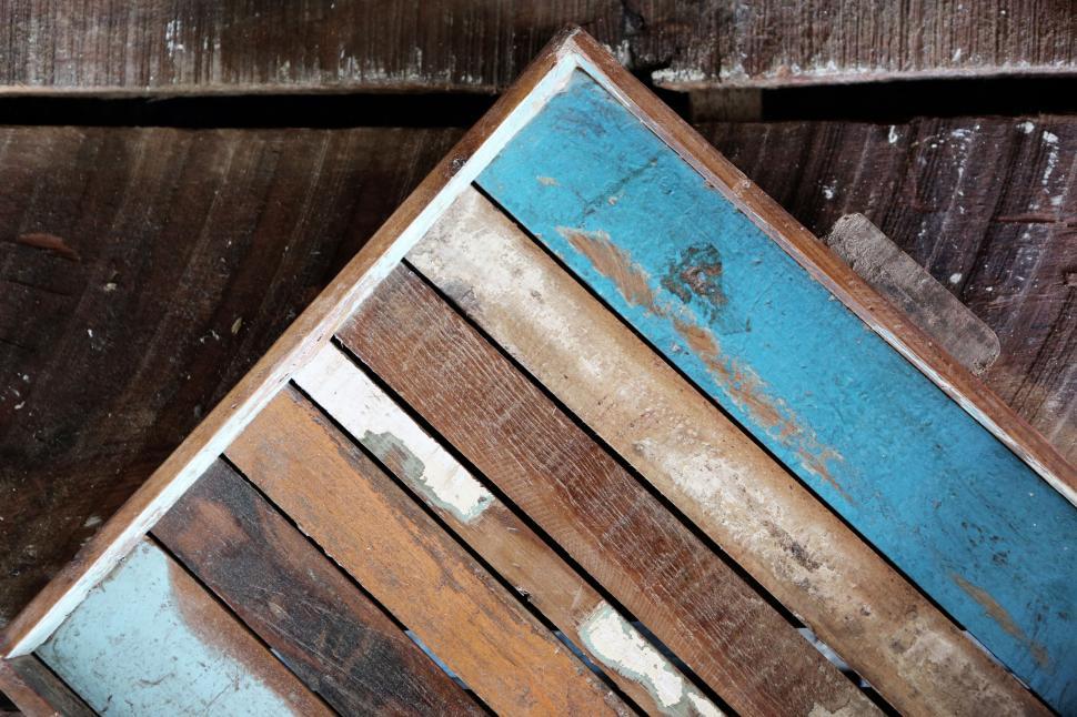 Free Image of Close-up of a colorful wooden mosaic on a rustic table surface. 