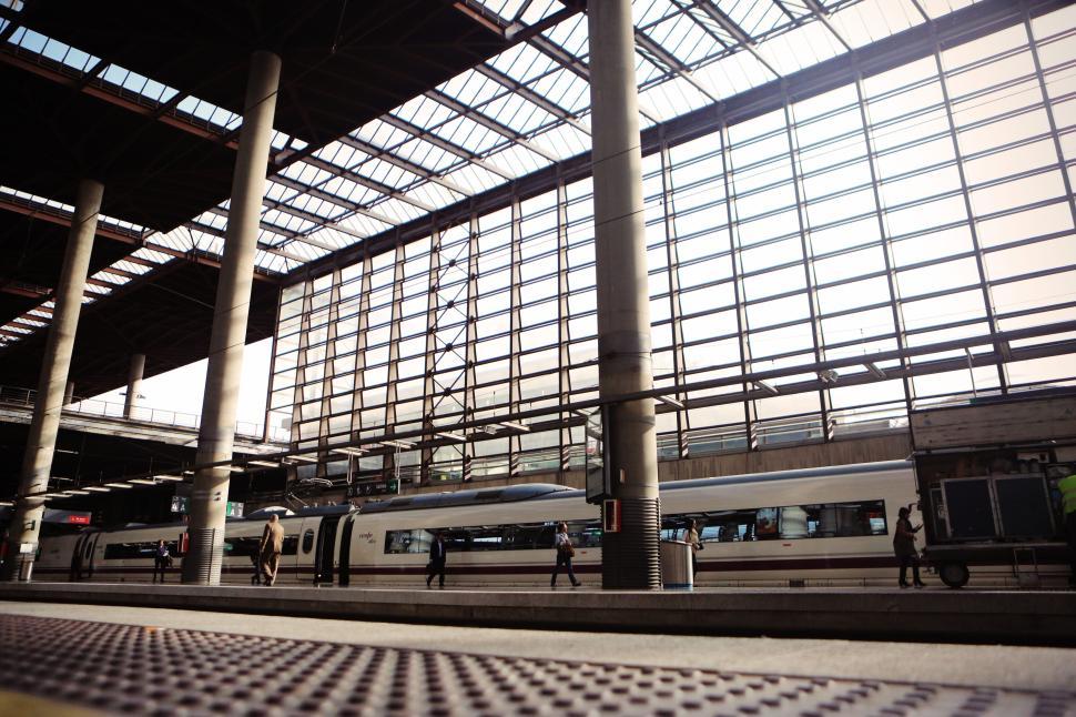 Free Image of Modern train station with a glass ceiling and sunlight 