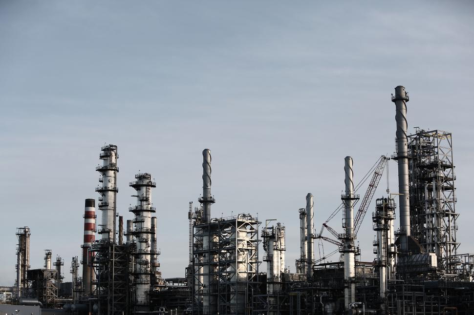 Free Image of Industrial refinery complex with multiple towers and structures. 