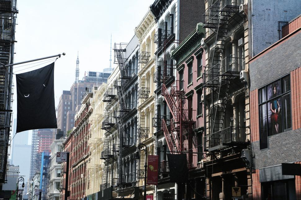 Free Image of Urban street view with fire escapes and historic buildings row. 