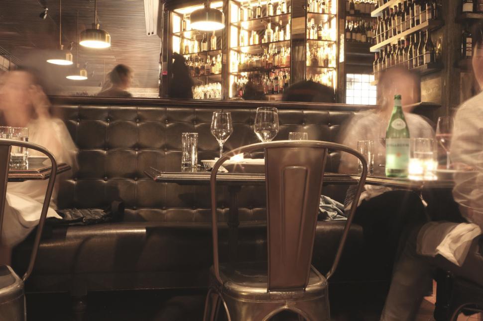 Free Image of Cozy restaurant interior with plush seating and elegant table setup. 