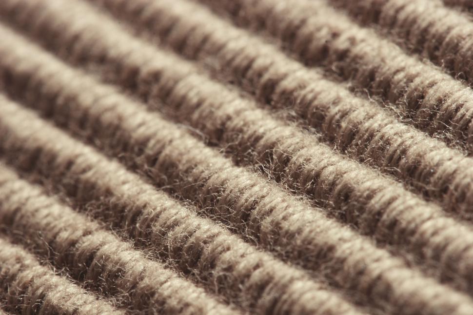 Free Image of Close-up of brown textured cloth showcasing intricate fabric details. 
