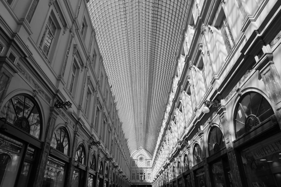 Free Image of Intricately designed interior of a grand architectural structure, skylight above. 