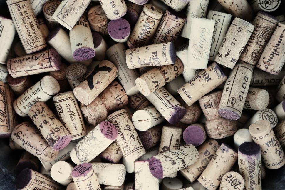 Free Image of A large collection of various wine corks arranged in random order 