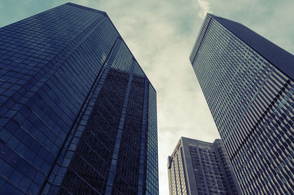 Free Image of Skyscrapers from low angle under a cloudy sky in urban downtown area 