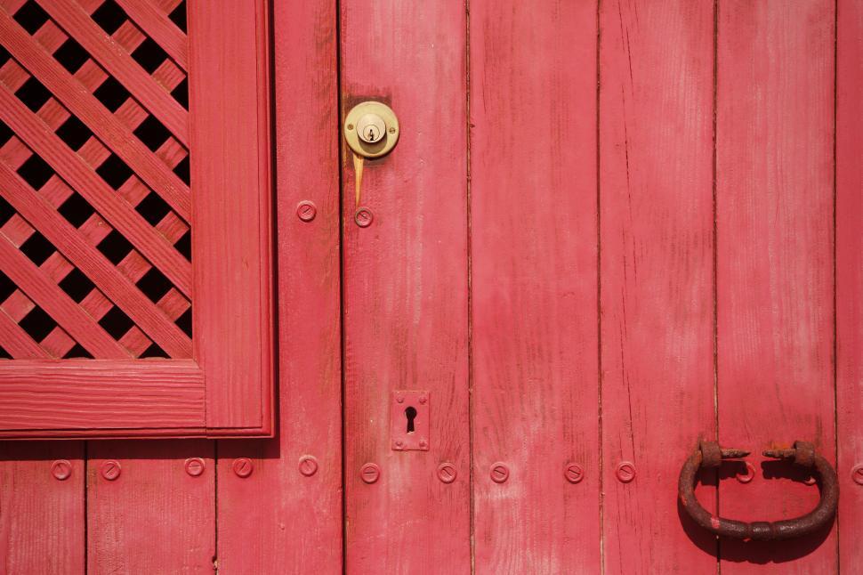 Free Image of Red Wooden Door with Brass Handle and Keyhole Detail 