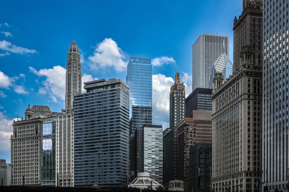 Free Image of Chicago skyline featuring high-rise buildings against a clear blue sky. 