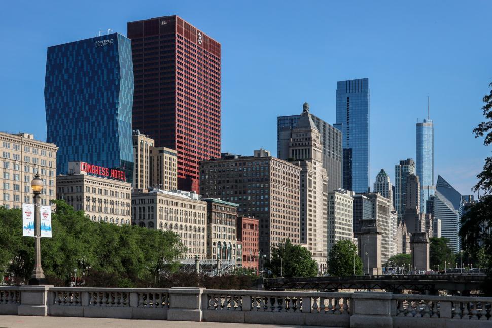 Free Image of Vibrant Cityscape with Iconic Buildings and Clear Blue Sky 