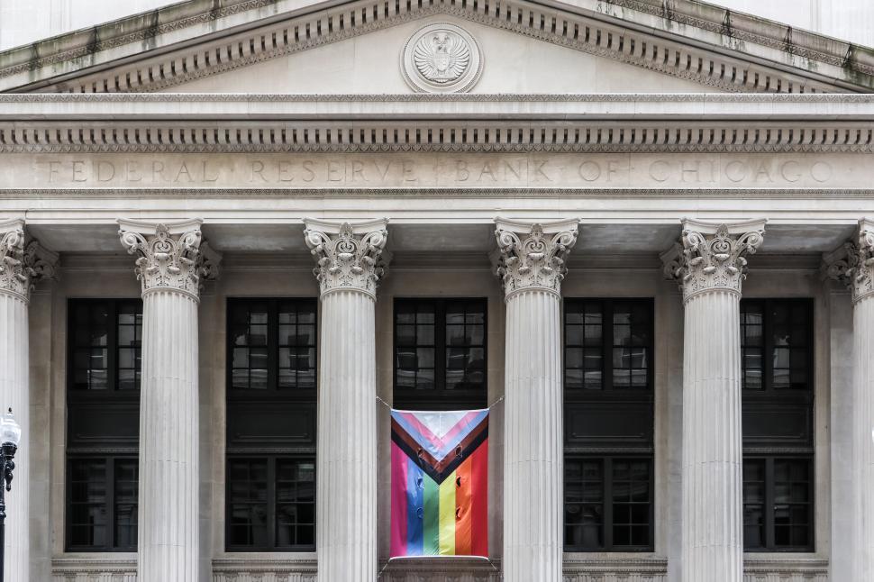 Free Image of Federal Reserve Bank of Chicago front facade with pride flag hanging 