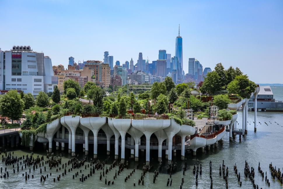 Free Image of Little Island park in Manhattan, extending over water with urban backdrop. 