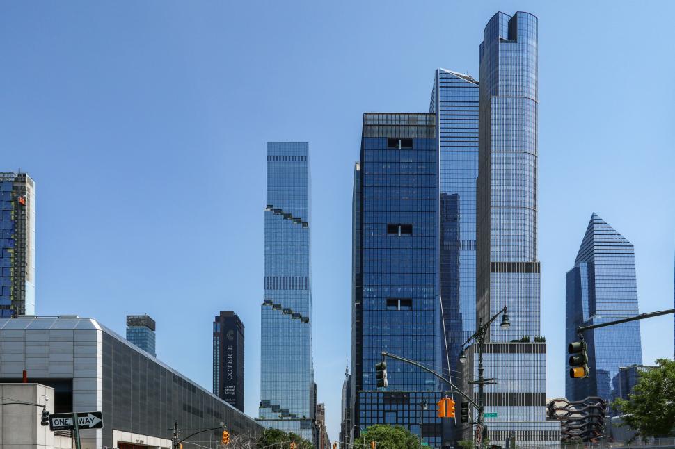 Free Image of Cluster of modern skyscrapers under clear blue sky in urban setting 