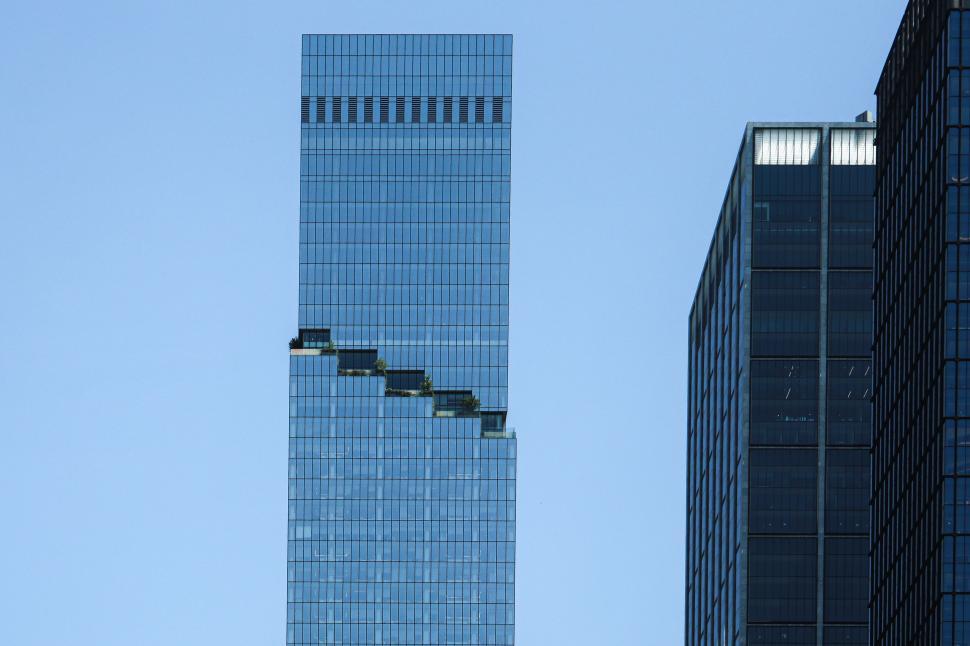 Free Image of Modern skyscraper with unique stepped design against blue sky 