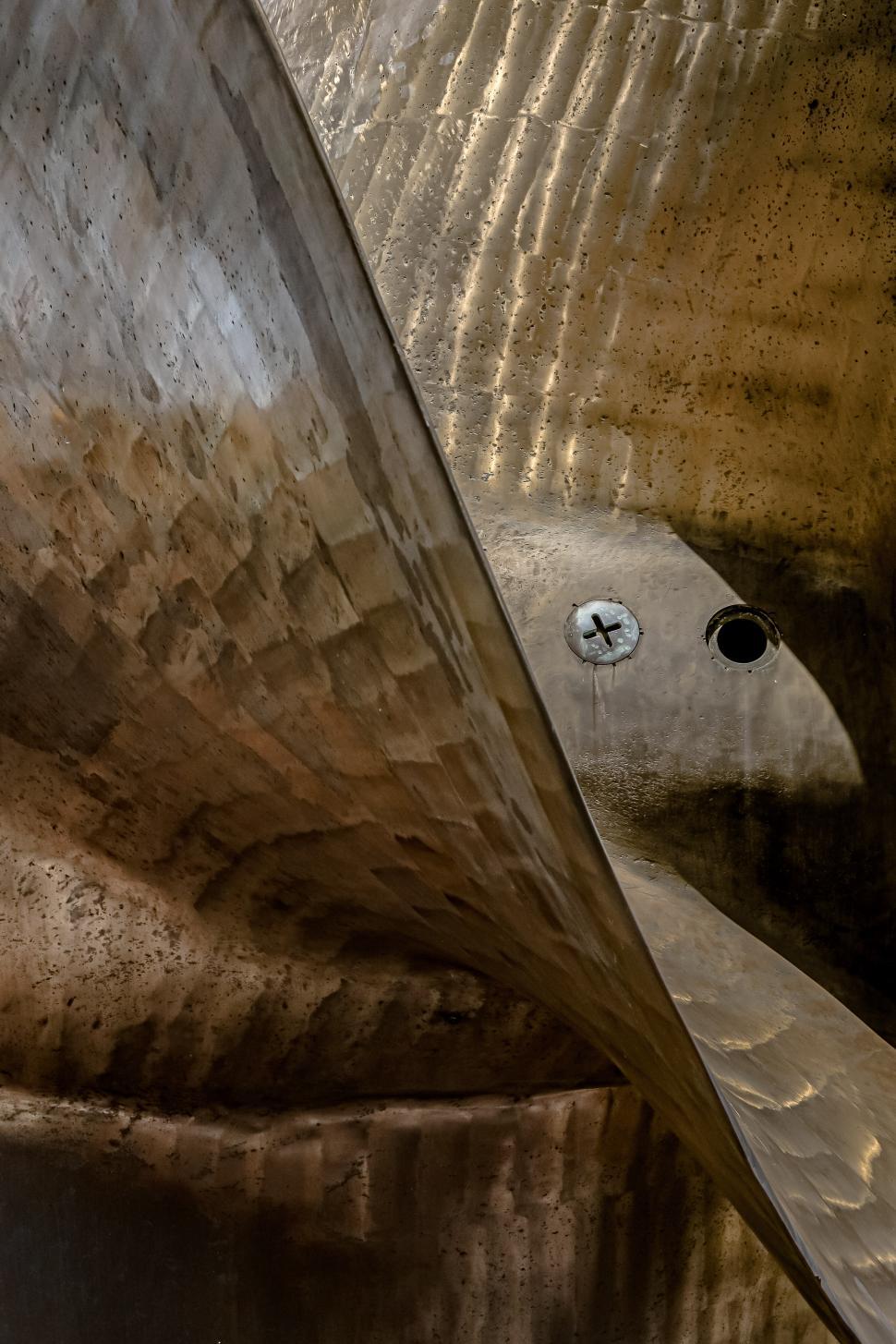 Free Image of Close-up of a metallic surface with unique textures and patterns 