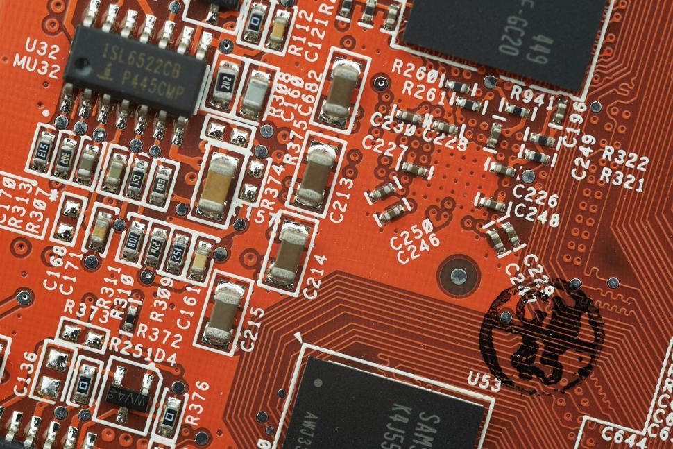 Free Image of Red circuit board with visible components and detailed connections 