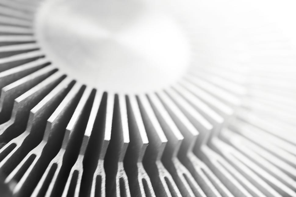 Free Image of Close-up of metal heat sink with fins under bright lighting effect 