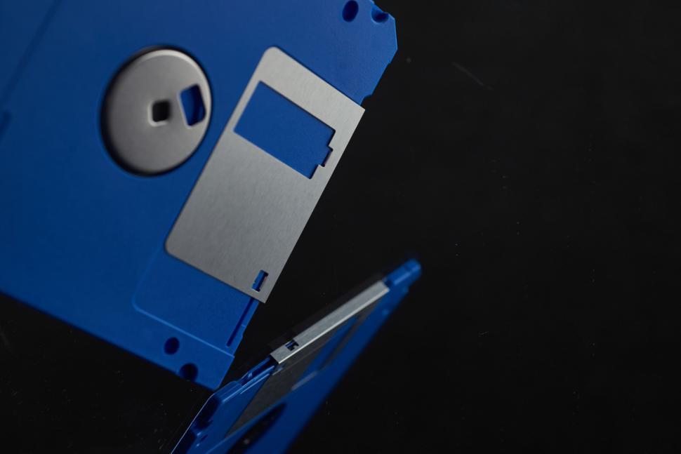 Free Image of Close-up of blue floppy disks against a black background. 