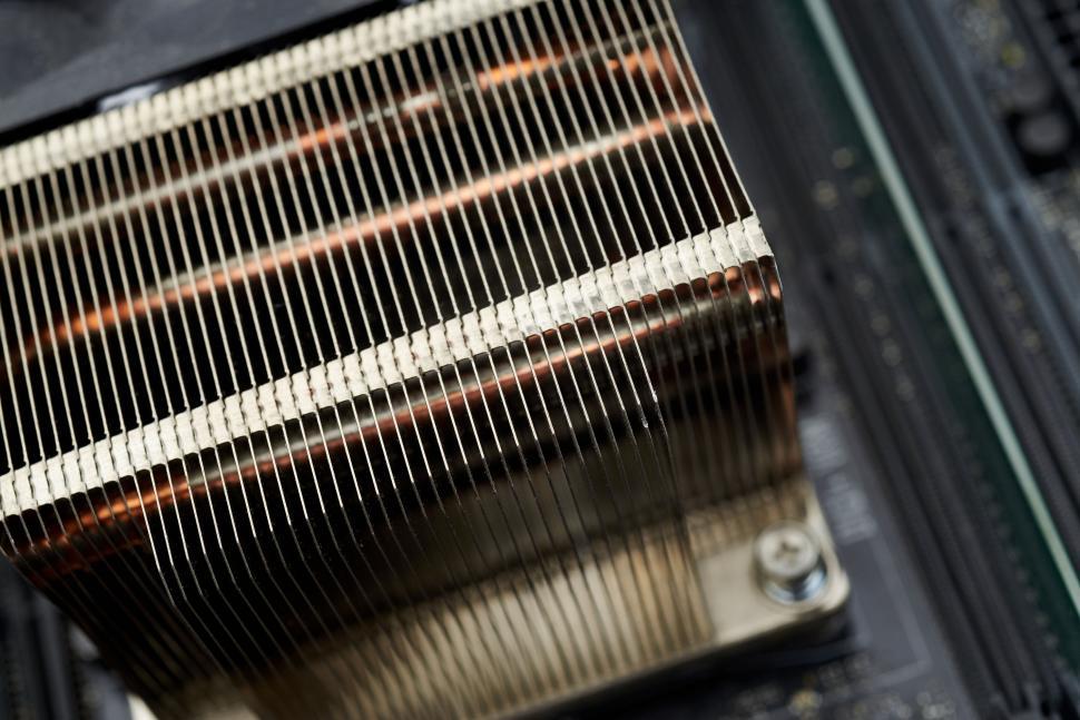 Free Image of Close view of a CPU cooler with metallic heat sink fins 