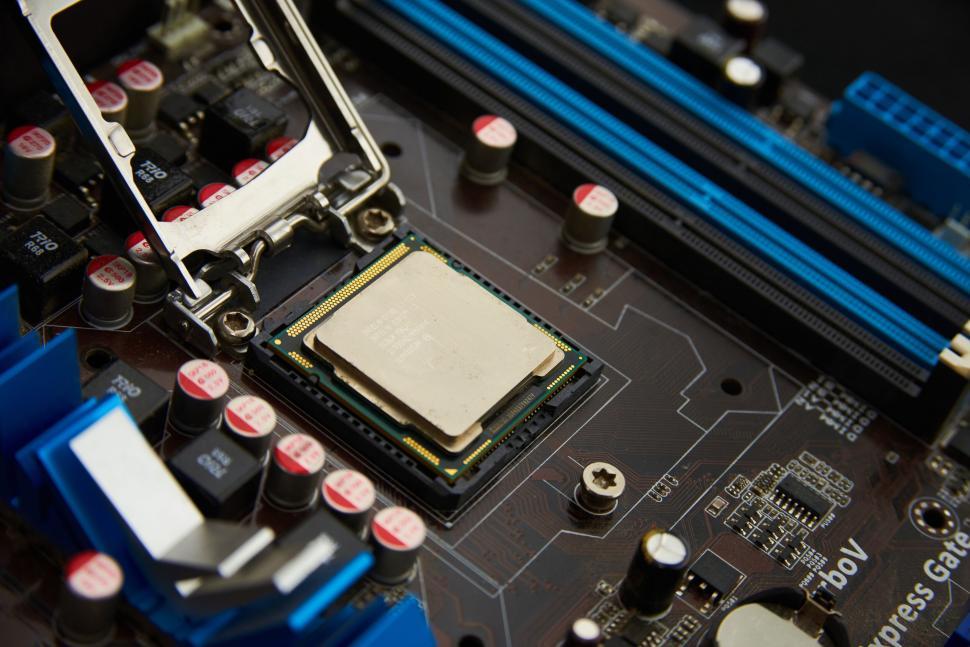 Free Image of CPU placed in motherboard socket showing computer hardware details. 