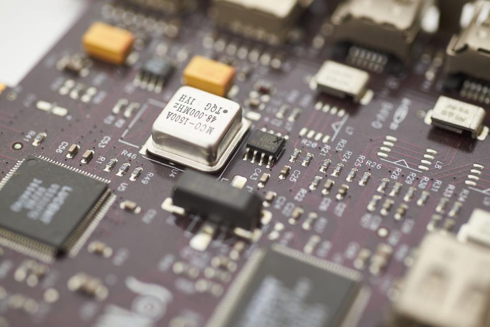 Free Image of Close-up of a PCB with various electronic components soldered 