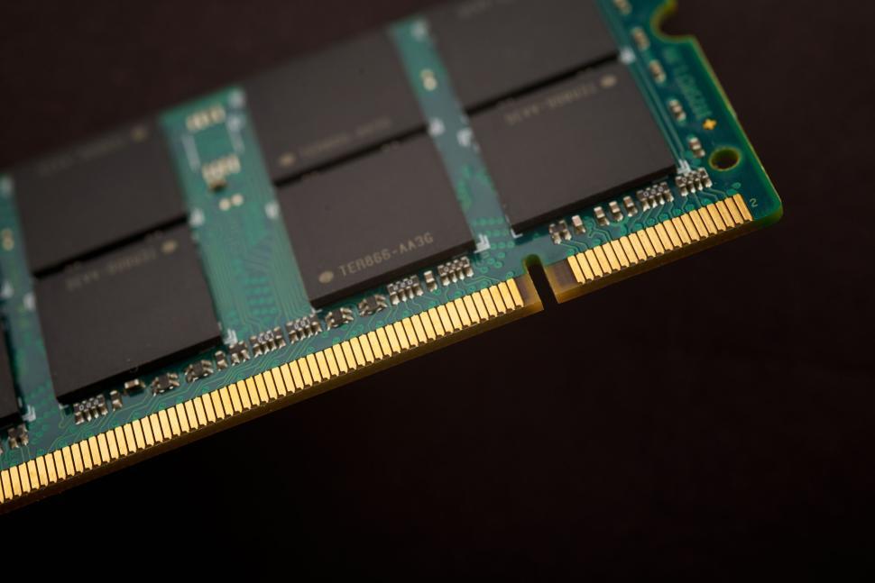 Free Image of Close-up of a computer RAM module with gold contact points 