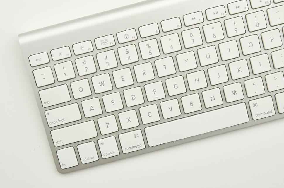 Free Image of Sleek and modern wireless keyboard in white with minimalist design. 