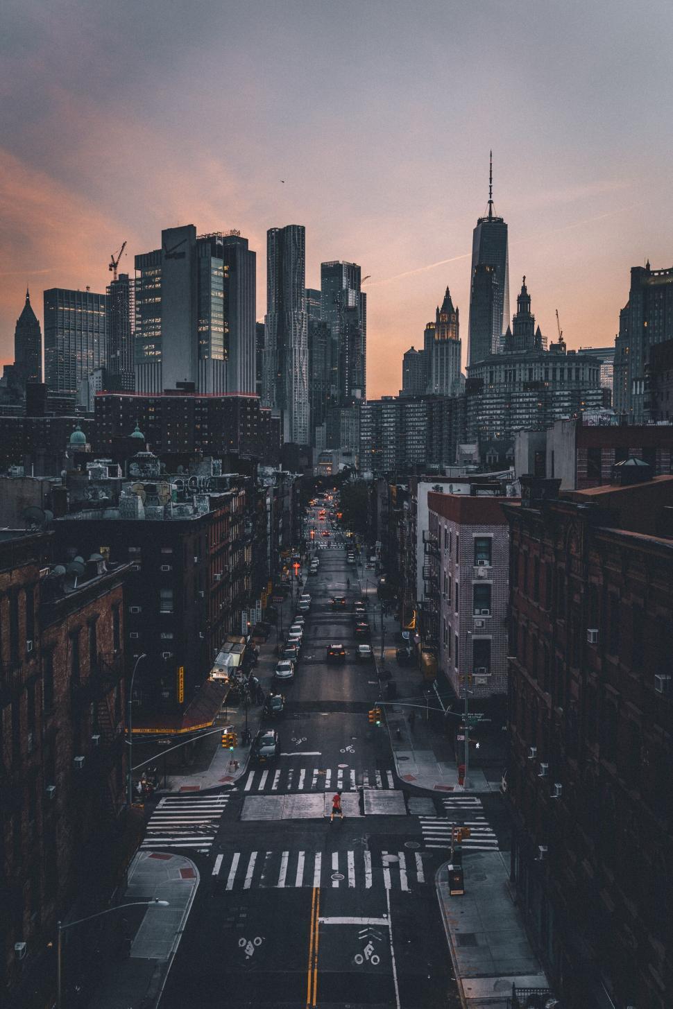 Free Image of Skyscrapers with a sunset background showing vibrant city life 