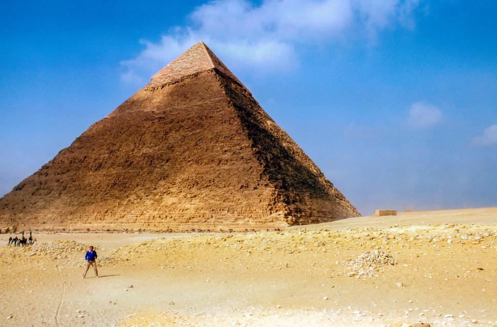 Free Image of The iconic Pyramid of Giza under a beautiful blue sky 