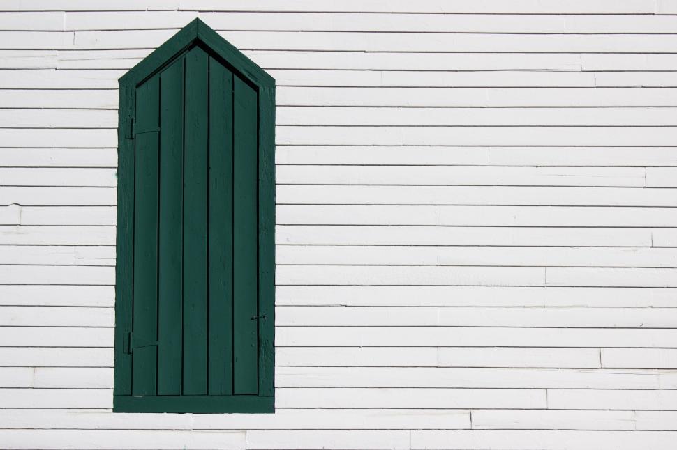 Free Image of Green door on a white clapboard wall, minimalistic and classic style 