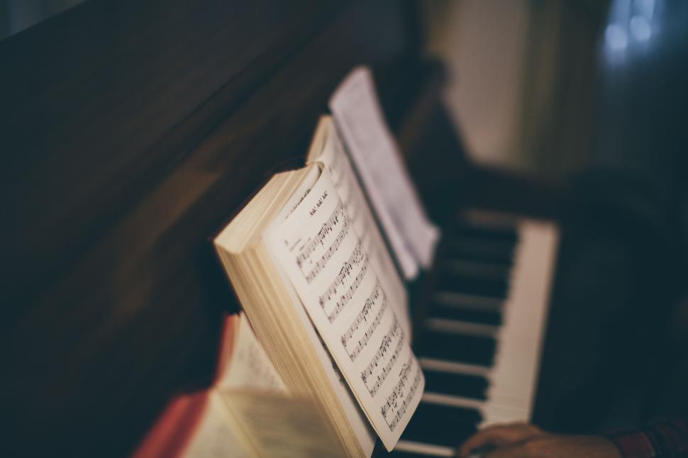 Free Image of Close-up of piano with sheet music, evoking classical music aura 