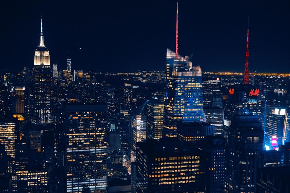 Free Image of Illuminated nighttime city skyline with famous buildings and lights 