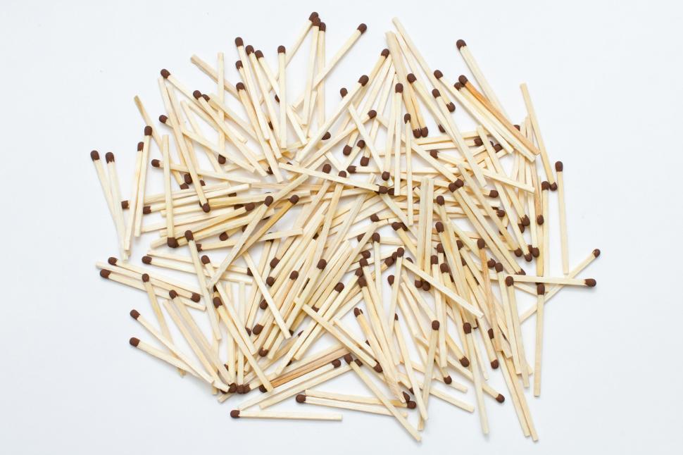 Free Image of Heap of wooden matches on white background 