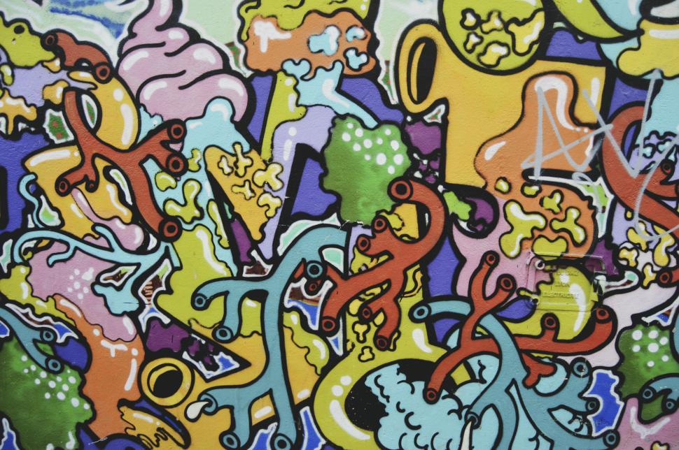 Free Image of Bright, colorful graffiti mural depicting abstract, vivid designs. 