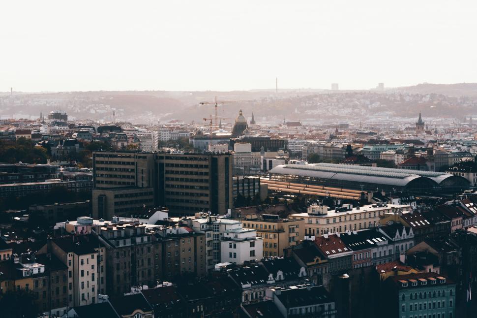 Free Image of A panoramic view of a densely built European city at sunset 