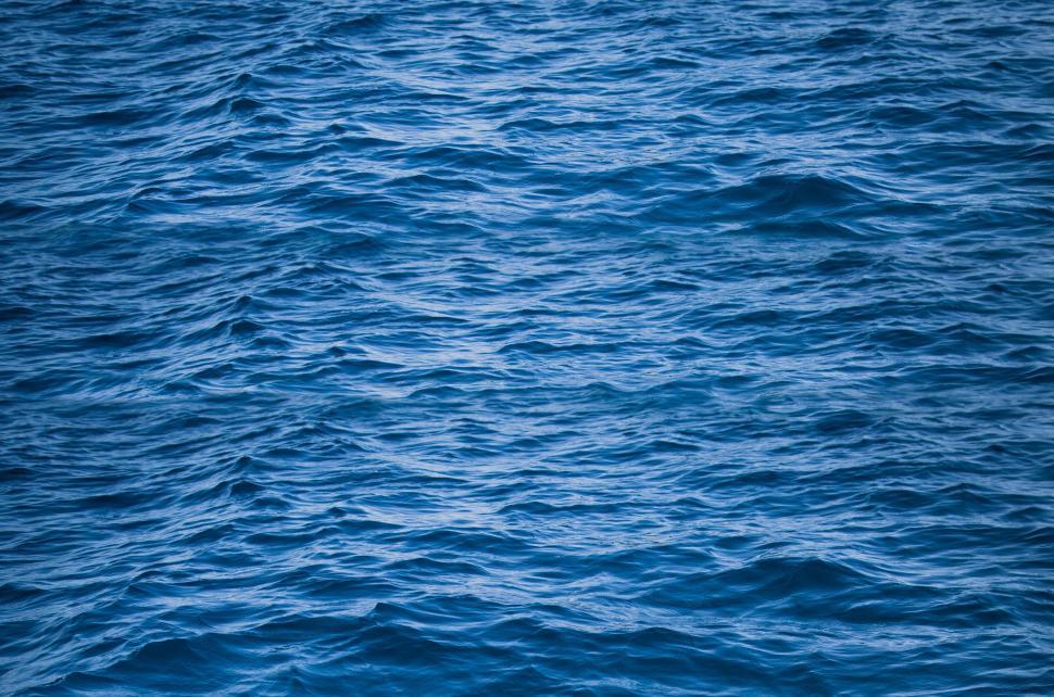 Free Image of Perfectly composed image of deep blue ocean waves rippling widely 