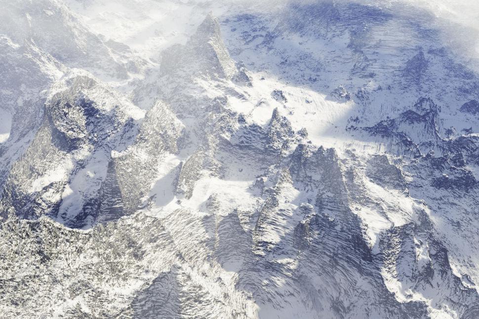 Free Image of Snow-covered mountain peaks creating a pristine and majestic scene. 