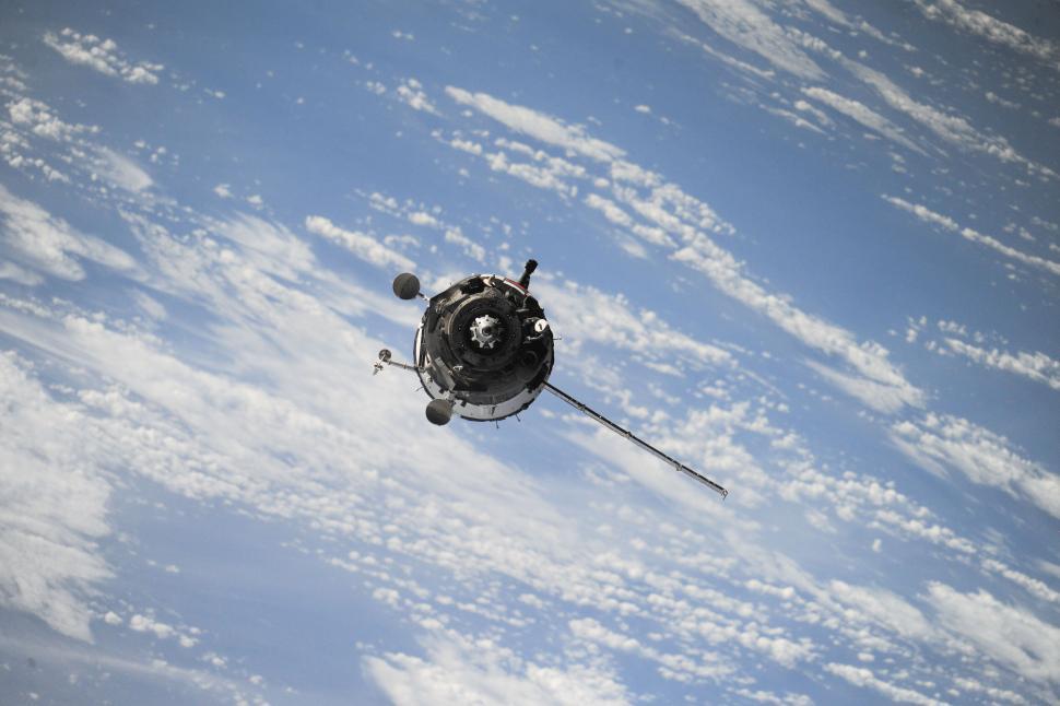 Free Image of Satellite floating above Earth s atmosphere capturing detailed imagery. 