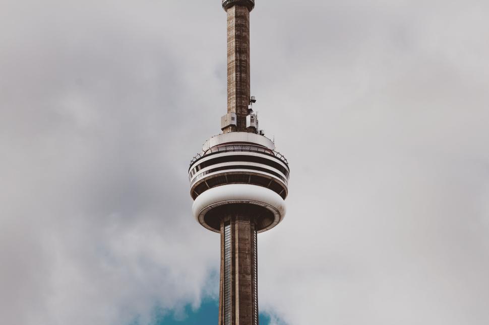 Free Image of Iconic tower against cloudy sky with partial view of observation deck 